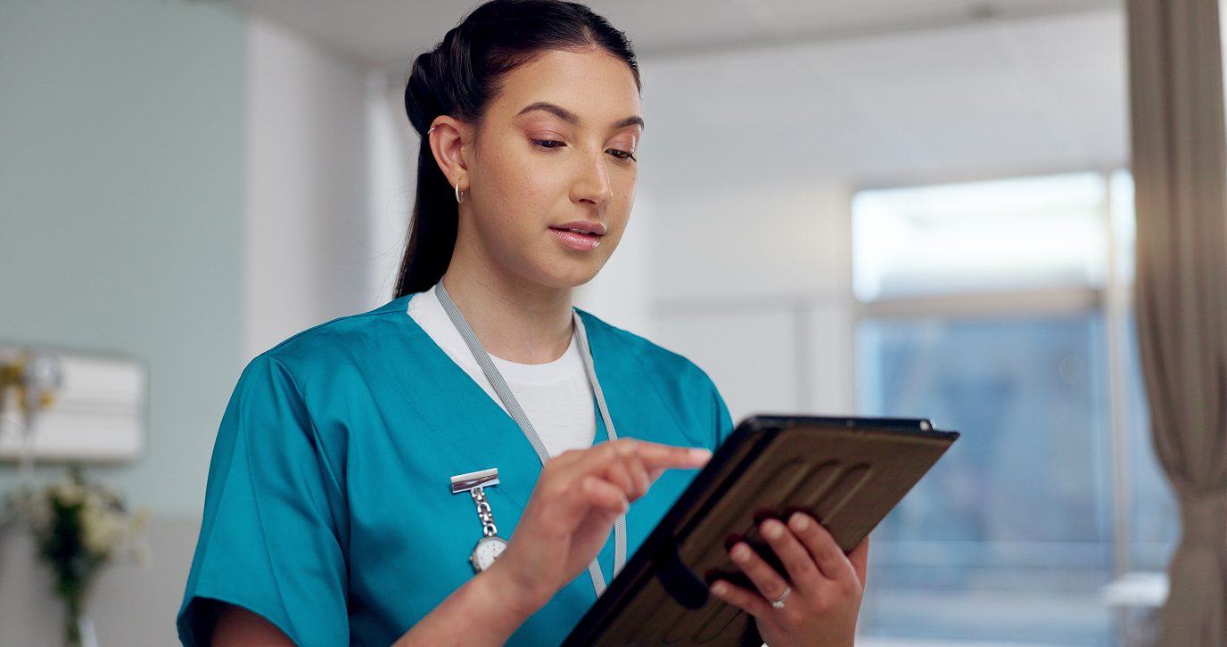 nurse or healthcare professional using a digital tablet | Clinical Registry Solutions